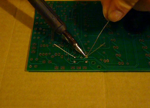 Adding solder to the heated joint