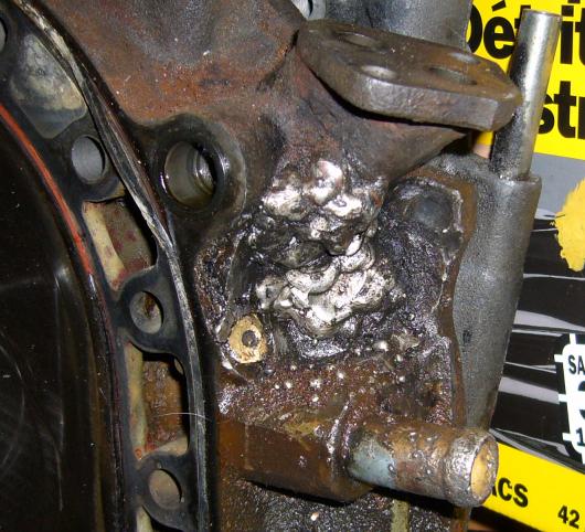 Attempted weld repair on rear iron oil boss