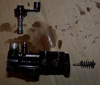 Adjustment lever and piston removed from MOP