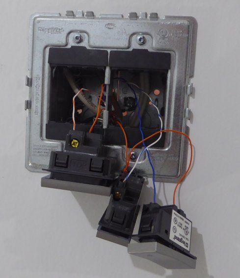Image of bathroom switches hanging from box with low voltage wiring attached