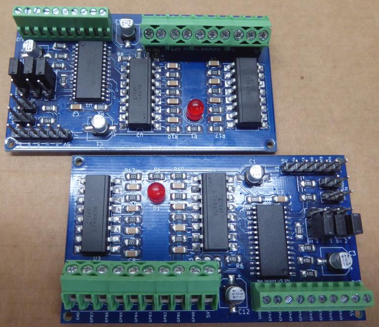 Picture of two MCP23017 I/O expander boards assembled and soldered with screw termiinals, jumpers