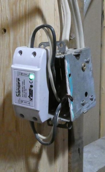 Image of Sonoff basic used as temporary switch hanging off electrical box in vestibule 
