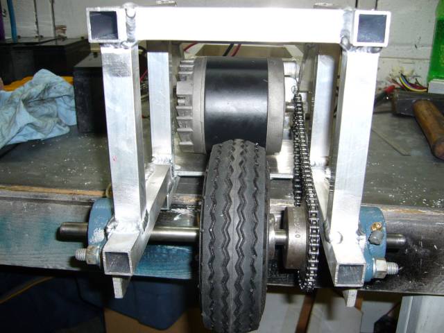 Rear wheel, axel, bearings, sprocket, chain and motor installed
