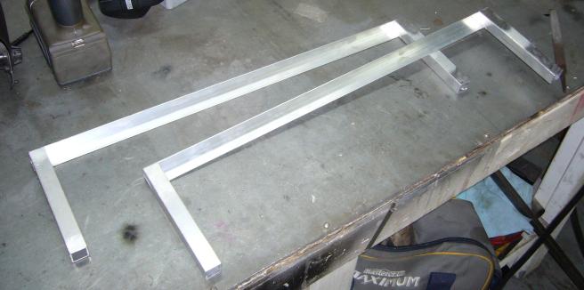 Cart rails welded together on bench