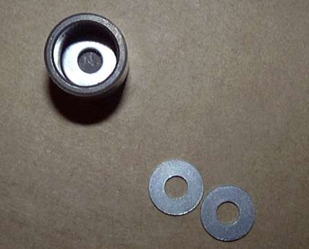 Washers inserted into piston